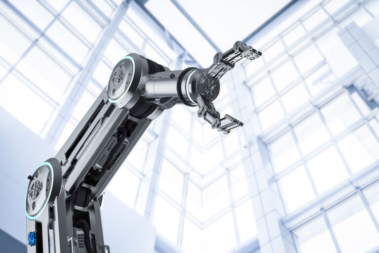 Upshot of a robotic arm against a wall of windows.